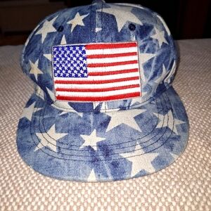 An American Flag snap back hat Lucky 7 Brand.